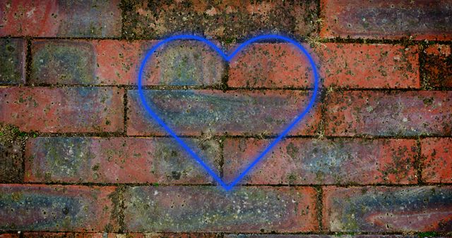 A vibrant neon heart glowing on a weathered brick wall, creating a blend of urban art and romantic symbolism. The contrasting textures and vivid blue color make it ideal for designs related to romance, creativity, or modern art themes. Suitable for social media posts, website backgrounds, or urban art collections.