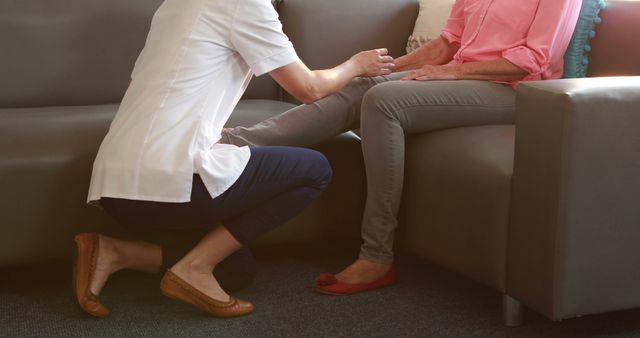 Caregiver assisting elderly woman on sofa at home - Download Free Stock Images Pikwizard.com