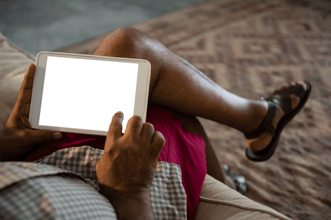 Partial View Man Using Tablet on Sofa with Blank Screen - Download Free Stock Videos Pikwizard.com