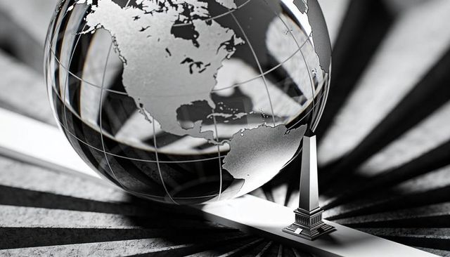 Monochrome glass globe on metal beam with obelisk casting dramatic radial shadows