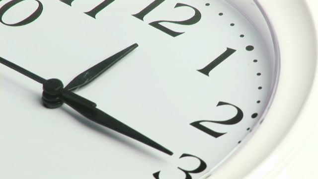 This video shows a close-up of an analog clock with visible numbers and hands moving to represent the passing of time. It can be used in presentations, articles, or any content discussing time management, deadlines, the importance of punctuality, or the concept of time.