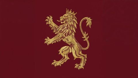 Royal british empire golden lion emblem on deep red background in heraldic style