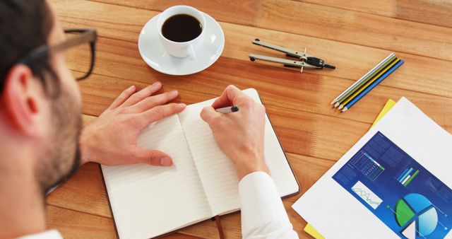 Businessman Analyzing Financial Reports with Coffee - Download Free Stock Images Pikwizard.com