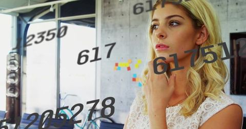 Woman Strategizing in Modern Office Workspace with Innovation Concepts