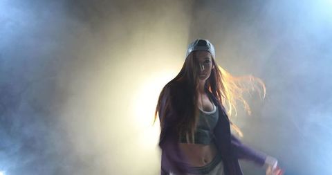 Young Woman Dancing in Dramatic Smoke with Backlight - Download Free Stock Images Pikwizard.com