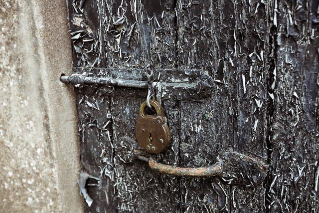 Old door with paint peelings and lock, backgrounds
