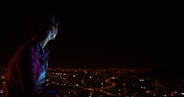 Person Gazing at City Lights at Night - Download Free Stock Images Pikwizard.com