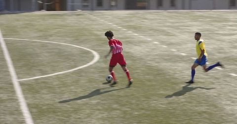 Young Soccer Players Competing Energetically on Field