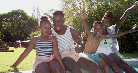 Happy Family Beachside Splashing Fun
