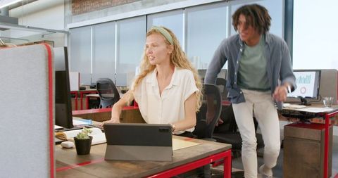 Excited Colleagues Celebrating Success at Modern Office