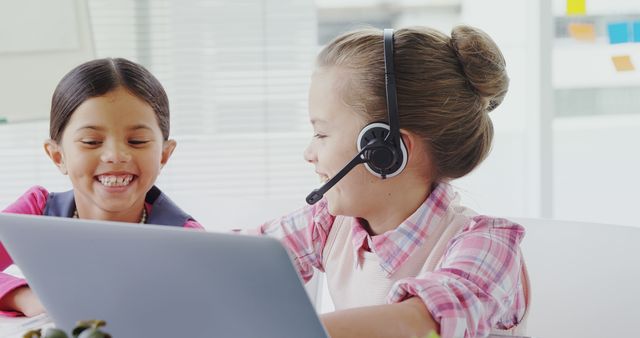 Happy Girls Learning Online with Headset and Laptop - Download Free Stock Images Pikwizard.com