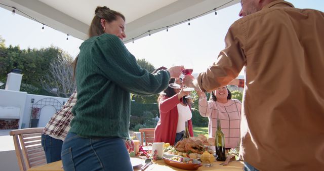 Friends Toasting at Outdoor Thanksgiving Celebration - Download Free Stock Images Pikwizard.com