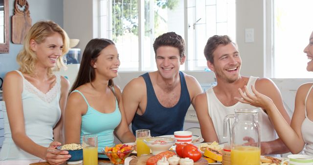 Group of Young Friends Eating Breakfast Together in Bright Kitchen - Download Free Stock Images Pikwizard.com