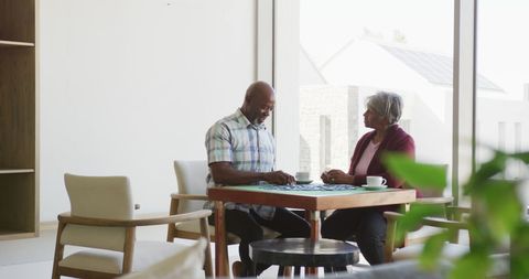 Senior Couple Enjoying Leisure Time Solving Puzzles Together - Download Free Stock Images Pikwizard.com