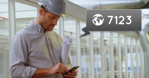 Engineer Texting with Increasing Notification Alert on Site