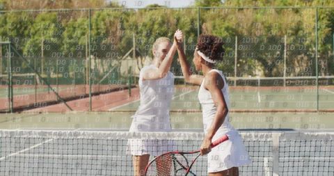 Female Tennis Players High-Fiving on Outdoor Court
