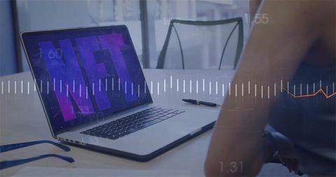 Displaying nft on laptop with data overlay and blockchain analytics in modern workspace