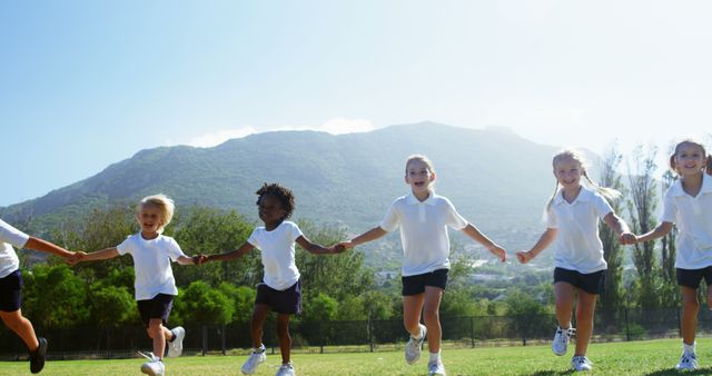 Happy Diverse Children Holding Hands Outdoor in Sunny Park - Download Free Stock Images Pikwizard.com