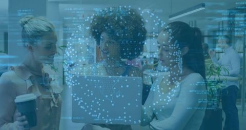 Diverse team collaborating over laptop with glowing data network overlay in modern office