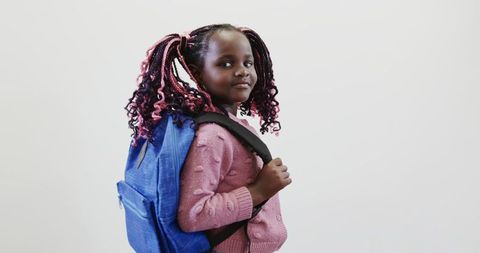 Confident Young Girl with Stylish Backpack and Colorful Hair