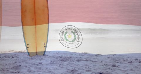 Surfboards on Sandy Beach Overlaid with Paraguay National Colors
