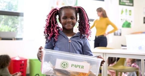 Child Learning Environmental Recycling in Classroom