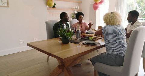 Joyful Dining Experience with Friends Celebrating Together