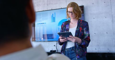Businesswoman Using Digital Tablet in Modern Office Setting - Download Free Stock Images Pikwizard.com