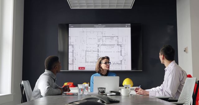 Architects Reviewing Blueprints in Modern Office Meeting - Download Free Stock Images Pikwizard.com