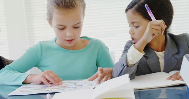 Diverse Schoolgirls Studying Together in Classroom - Download Free Stock Images Pikwizard.com