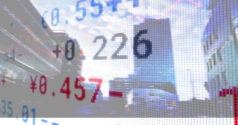 Financial data over cityscape with digital display screen