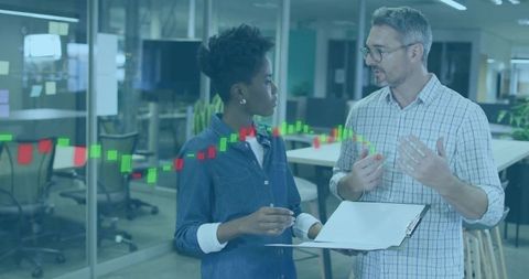 Team Collaborating on Creative Project in Modern Office with Chart Overlay