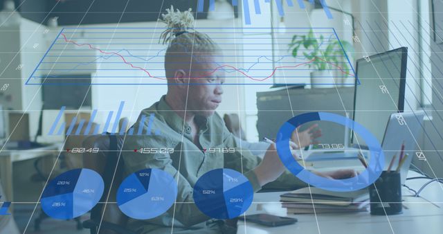 Young Businessman Analyzing Data with Digital Interface in Modern Office - Download Free Stock Images Pikwizard.com