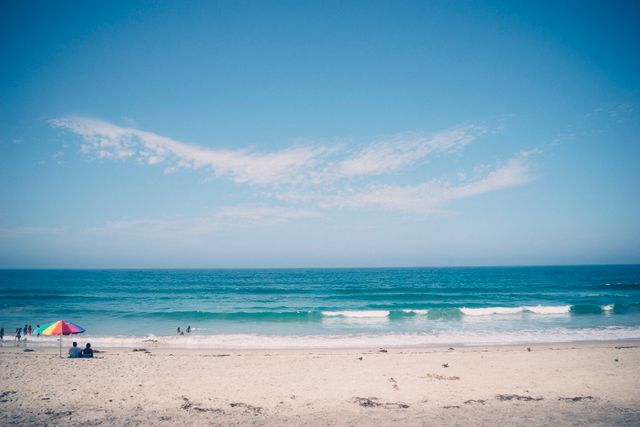 Serene Beach with Clear Blue Sky and White Sand - Download Free Stock Photos Pikwizard.com