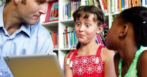 Children Reacting to Digital Tablet with Teacher in Library - Download Free Stock Images Pikwizard.com