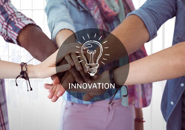 Diverse group of people stacking hands together with an illuminated light bulb icon and the word 'innovation' overlay. Ideal for illustrating concepts of teamwork, creativity, collaboration, and innovative thinking in business or educational settings. Perfect for use in presentations, websites, and marketing materials promoting unity and collective effort.