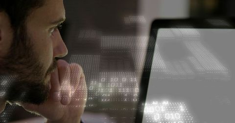 Bearded man studying laptop with binary overlay analyzing cybersecurity data visualization