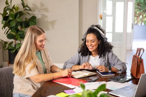 Diverse Friends Collaborating in Home Office Space