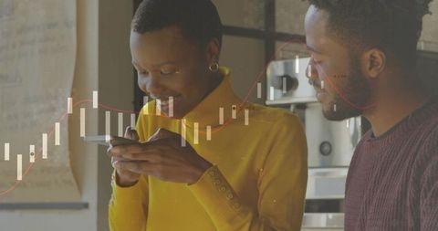 Couple collaborating on smartphone while viewing candlestick stock chart overlay in kitchen