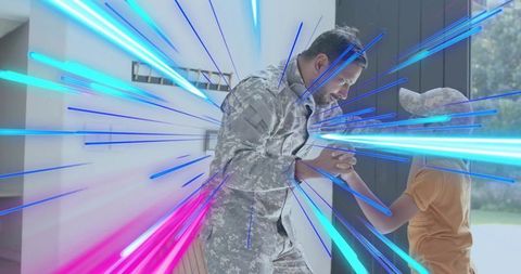 Military homecoming father and son holding hands at doorway with colorful light streaks