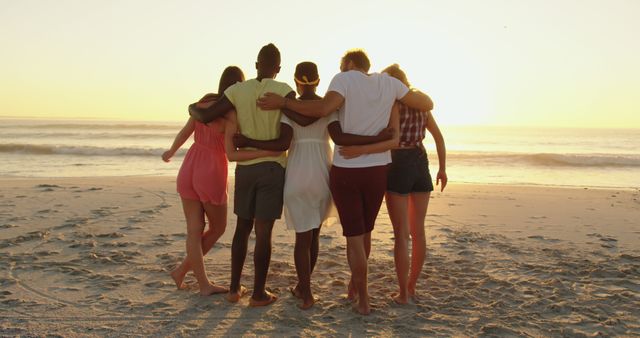 Group of Friends Embracing on Beach During Sunset - Download Free Stock Images Pikwizard.com