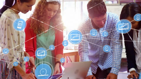 Team Collaborating with Digital Technology Networks in Creative Office