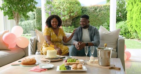 Joyful Celebration with Dessert and Fruits Outdoors