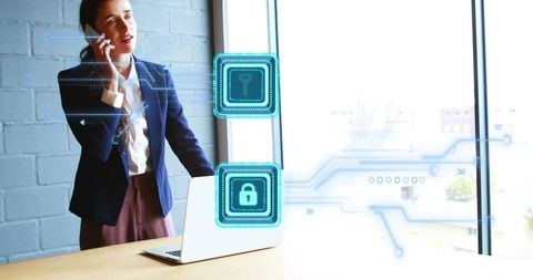 Businesswoman Discussing Cybersecurity Over Phone in Modern Office