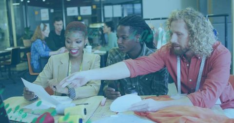 Diverse designers collaborating with color swatches in modern office