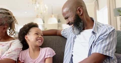 Grandfather Enjoying Warm Moment with Young Granddaughter