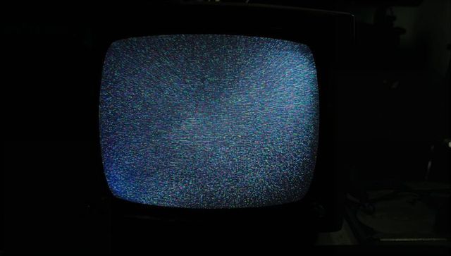 Vintage CRT Television Displaying Static Screen Snow