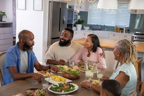 Diverse Family Enjoying Meal in Modern Home Kitchen
