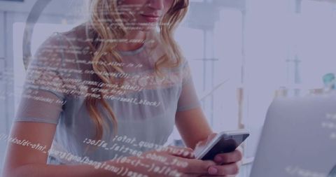 Woman Analyzing Code on Smartphone in Modern Office Environment