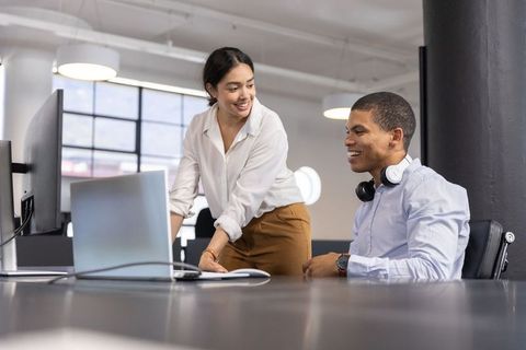 Coworkers Collaborating in Modern Open-Plan Office Environment